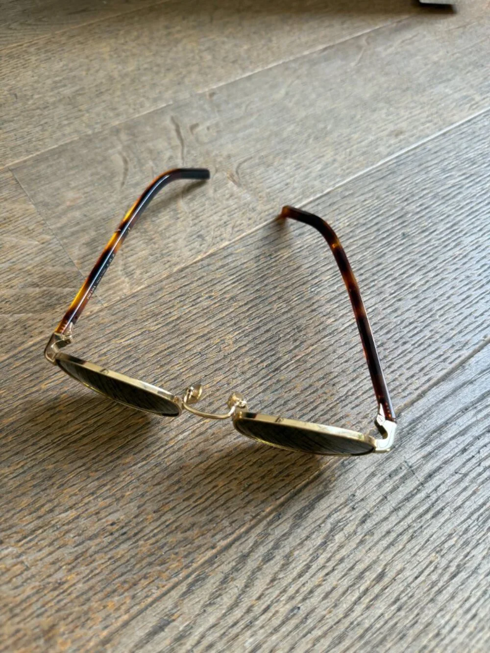 Prada PR oval sunglasses in gold with brown lenses